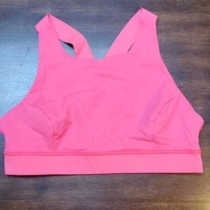 Neon pink Lululemon sports bra
